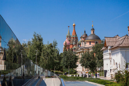 Moscow, Russia: The Church of the Great Martyr Barbara and St. Basil's Cathedral on Varvarka Street near Red Square on a sunny summer day. View of the temple from the Zaryadye Park.のeditorial素材
