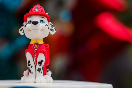 MOSCOW, RUSSIA, June 2023. Birthday cake for children's birthday in the style of "Puppy Patrol". Marshal's puppy figurine. Balloons in the background. The concept of a children's holiday.のeditorial素材