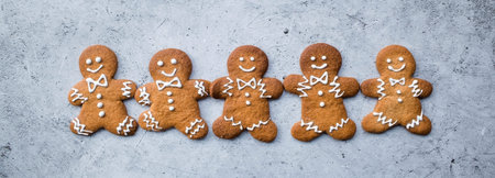 Homemade gingerbread Christmas cookies in icing sugar. Delicious gingerbread cookies on the...