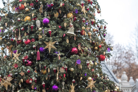 Beautiful festive decorations on the Christmas tree. Close-up. Beautiful Christmas background. The concept of decorations and decor for the new year. New Year's Card 2025の写真素材