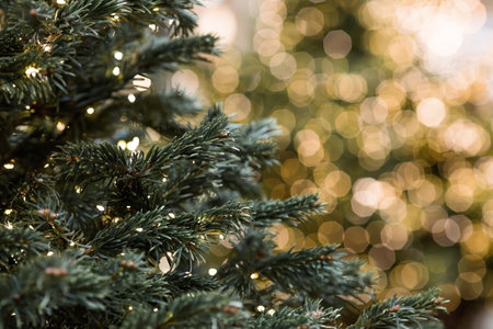 Beautiful festive decorations on the Christmas tree. Close-up. Beautiful Christmas background. The concept of decorations and decor for the new year. New Year's Card 2025の写真素材