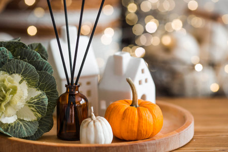 Aroma diffuser. Autumn scented perfumes for the home in a glass bottle with sticks as an air...
