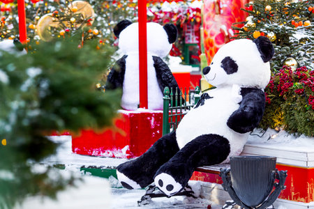 Plush stuffed pandas and Chinese red lanterns on Tverskaya Street in Moscow. Close-up. The first ever meeting of the Chinese New Year 2024 in Moscow.の写真素材