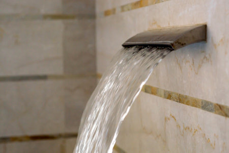 Wellness center. Back and neck massage equipment in the pool. Cascading high-pressure water jet in the spa.の写真素材