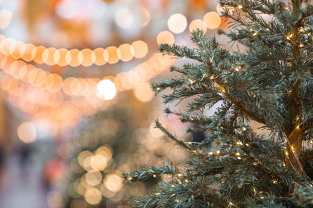 New Year's card 2026. Festive garlands and lights on the Christmas tree. Close-up. Beautiful...