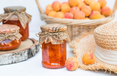 Preservation and summer harvest. Homemade healthy jelly, apricot jam. Preparing jars. Sweets and fruits.の写真素材