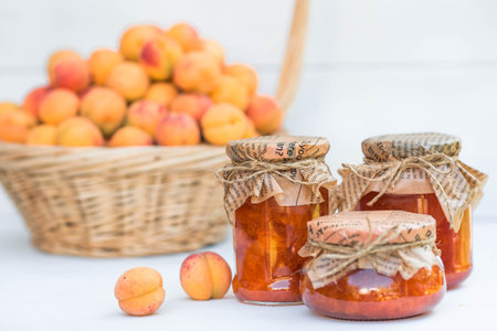 Preservation and summer harvest. Homemade healthy jelly, apricot jam. Preparing jars. Sweets and fruits.の写真素材