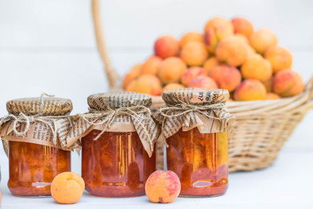 Preservation and summer harvest. Homemade healthy jelly, apricot jam. Preparing jars. Sweets and...