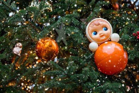 Holiday decorations on the streets of Moscow. Beautiful Christmas background. Soviet tumbler toy on a Christmas tree.の写真素材