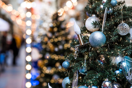 Holiday Christmas tree decorations on a Christmas tree in Moscow. New Year's postcard 2026. Magical Christmas background.の写真素材