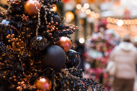 Stylish festive black toys on the New Year's tree in Moscow. The concept of preparing and decorating for the new year 2026.の写真素材