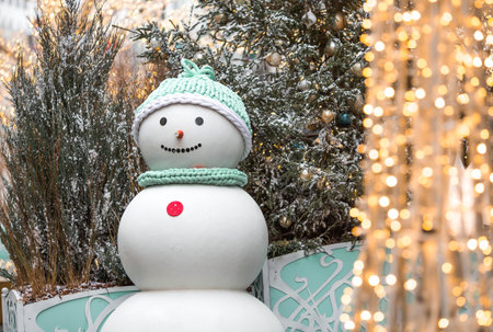 Concept of preparation and decoration for the New Year 2026. Holiday snowmen on the streets of Moscow. Christmas background with a snowman.の写真素材