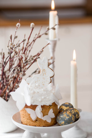 Happy Easter 2026. Stylish Easter still life. Easter cake with white rabbit and butterflies, Easter...