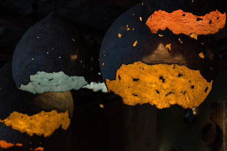 Decorative lights in an abstract shape, suspended from the ceiling in the interior. Interior design concept.の写真素材