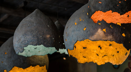 Decorative lights in an abstract shape, suspended from the ceiling in the interior. Interior design concept.の写真素材