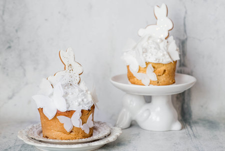Happy Easter 2026. Stylish Easter still life. Easter cake with a white rabbit and airy rice paper...