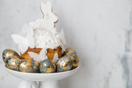 Happy Easter 2026. Easter cake with white bunnies and rice paper butterflies and Easter eggs on a...