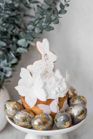 Easter treats and food. Happy Easter 2026. Easter cake with white gingerbread bunnies, rice paper...