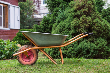 Preparing the garden for autumn and winter. Closing the summer season. A garden wheelbarrow in the...