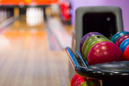 Bowling club with colorful bowling balls and pins. Games and entertainment.