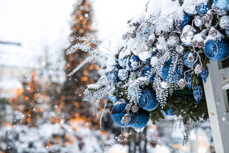 New Year's tree with blue and silver decorations. Fragment of a Christmas tree with decorations. Christmas balls on a Christmas tree. Concept of the winter holiday of New Year. Moscow, Russia