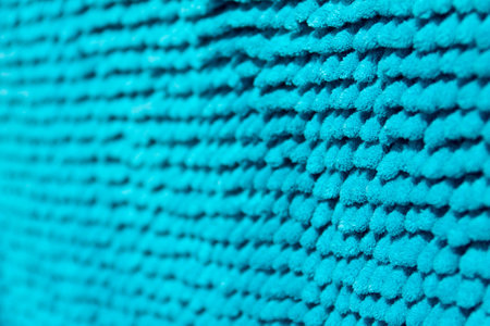 Bright blue background with blur, the basis is the deep-piled carpet close-up の写真素材