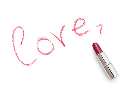 Inscription  love  on a white background  The inscription is made using lipstick の写真素材