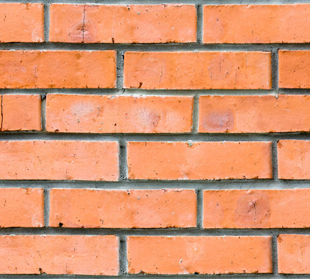 Seamless texture. Wall of red bricks. Red brick wall. Grunge style.