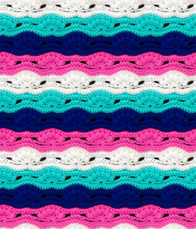 Seamless knitted texture. The pattern in the form of waves crocheted with multi-colored threads....
