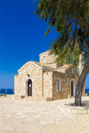 Cyprus, Protaras - 22 June 2021. Church of Saint Elias. An ancient 14th-century Orthodox church on top of a small mountain, overlooking the whole village.のeditorial素材