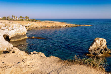 View of the sea caves from a place called Kamara Tou Koraka. Cape Greco National Forest Park on the island of Cyprus. Coast at sunset.の写真素材