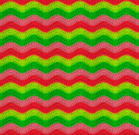 Seamless crochet zigzag pattern is crocheted in bright neon threads. Acrylic baby yarn. African...