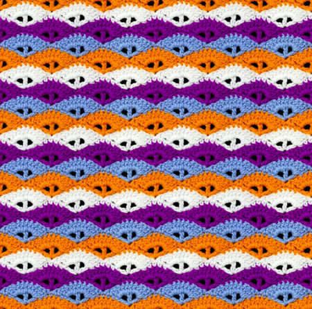 Contrasting seamless knitted texture. The pattern in the form of seashells is crocheted with multi-colored threads. acrylic yarn.の写真素材