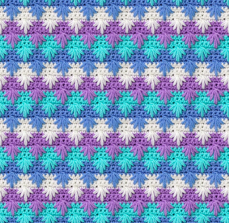 Seamless knitted texture. The pattern in the form of snowflakes is crocheted from colored acrylic...