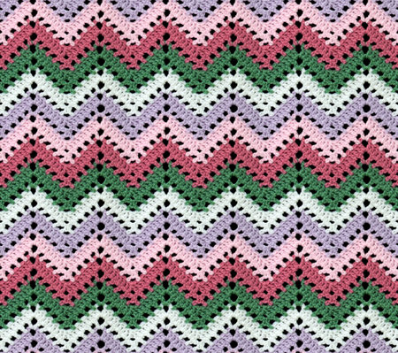 Seamless knitted pattern in the form of openwork zigzags crocheted with threads of contrasting...
