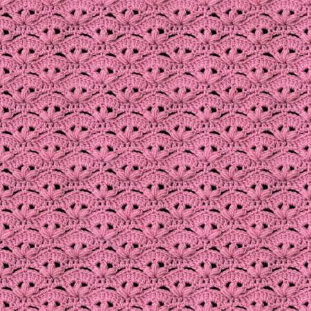 Seamless crochet pattern in the form of voluminous flowers crocheted with pink threads. Acrylic baby yarn. Knitted blanket.の写真素材