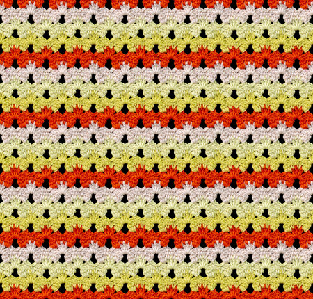 Seamless knitted texture in floral style. The pattern is crocheted from multicolored cotton yarn....