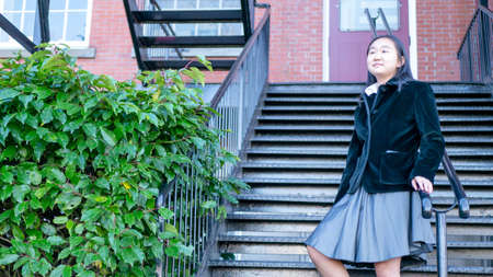 Schoolgirl standing in talksの写真素材