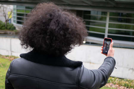 Man posing for mobile phoneの写真素材