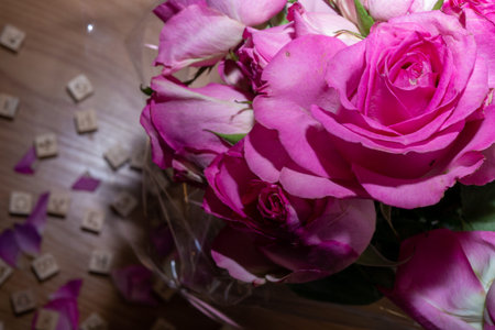 Pink roses and the letters LOVE