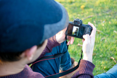 Man's hand touching camera