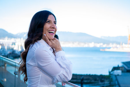 Mexican woman smiling at Canada Place in Vancouver