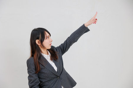 Businesswoman pointing to a blank spaceの写真素材