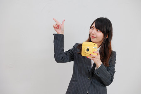 Woman in a suit with a yellow chekiの写真素材