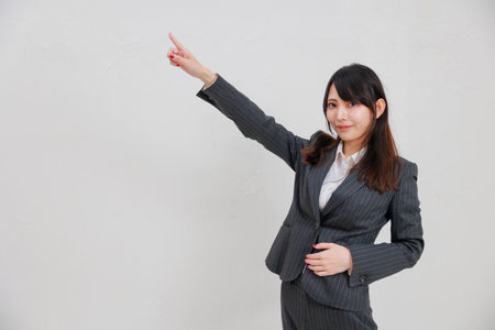 Businesswoman pointing to a blank spaceの写真素材