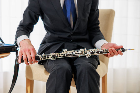 Close-up of a clarinet in the hands of a manの写真素材