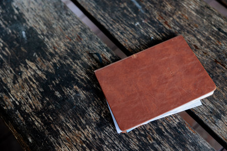Old book on wooden table. Vintage style. Selective focus.の写真素材