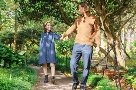 Young couple walking in the park on a sunny day. Man and woman walking in the park.