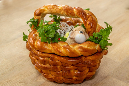 Easter basket made of bread and decorated with sheep, chicken and vegetables