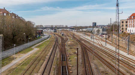 Aarhus, Denmark - 24 march 2020:  Train rails near Aarhus train station. in the background the riggade bridge is seenのeditorial素材